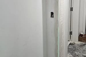 Corner bead fitted to a drywall outside corner